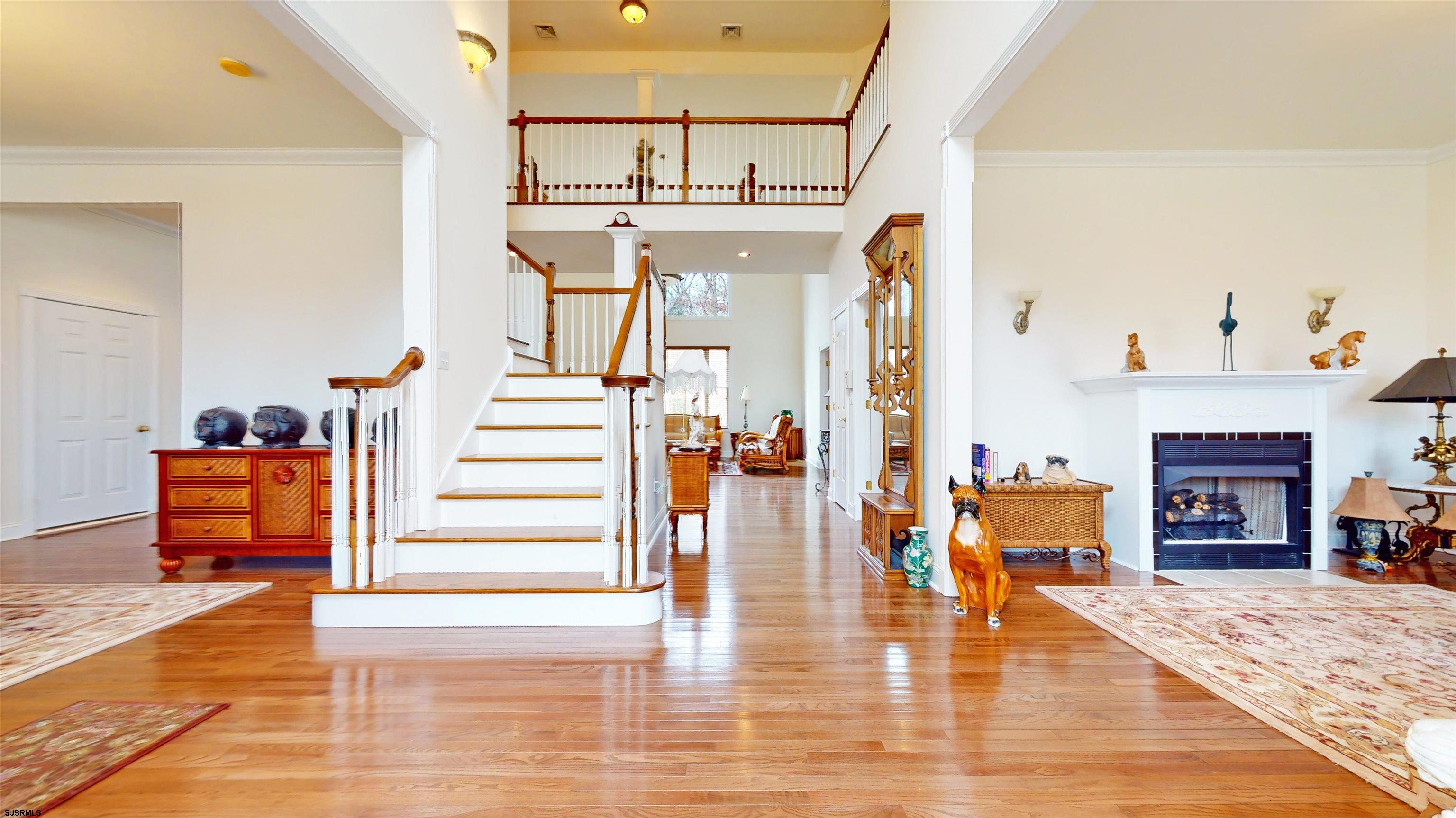 33 North New York Road Smithville, NJ 08205 - Photo 8 of 53 a living room with furniture and a fireplace