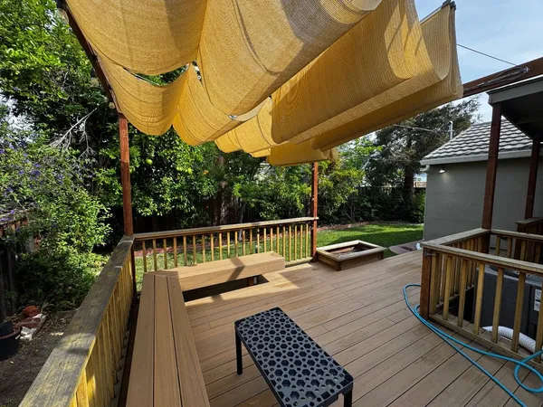 a view of balcony with wooden floor and outdoor seating