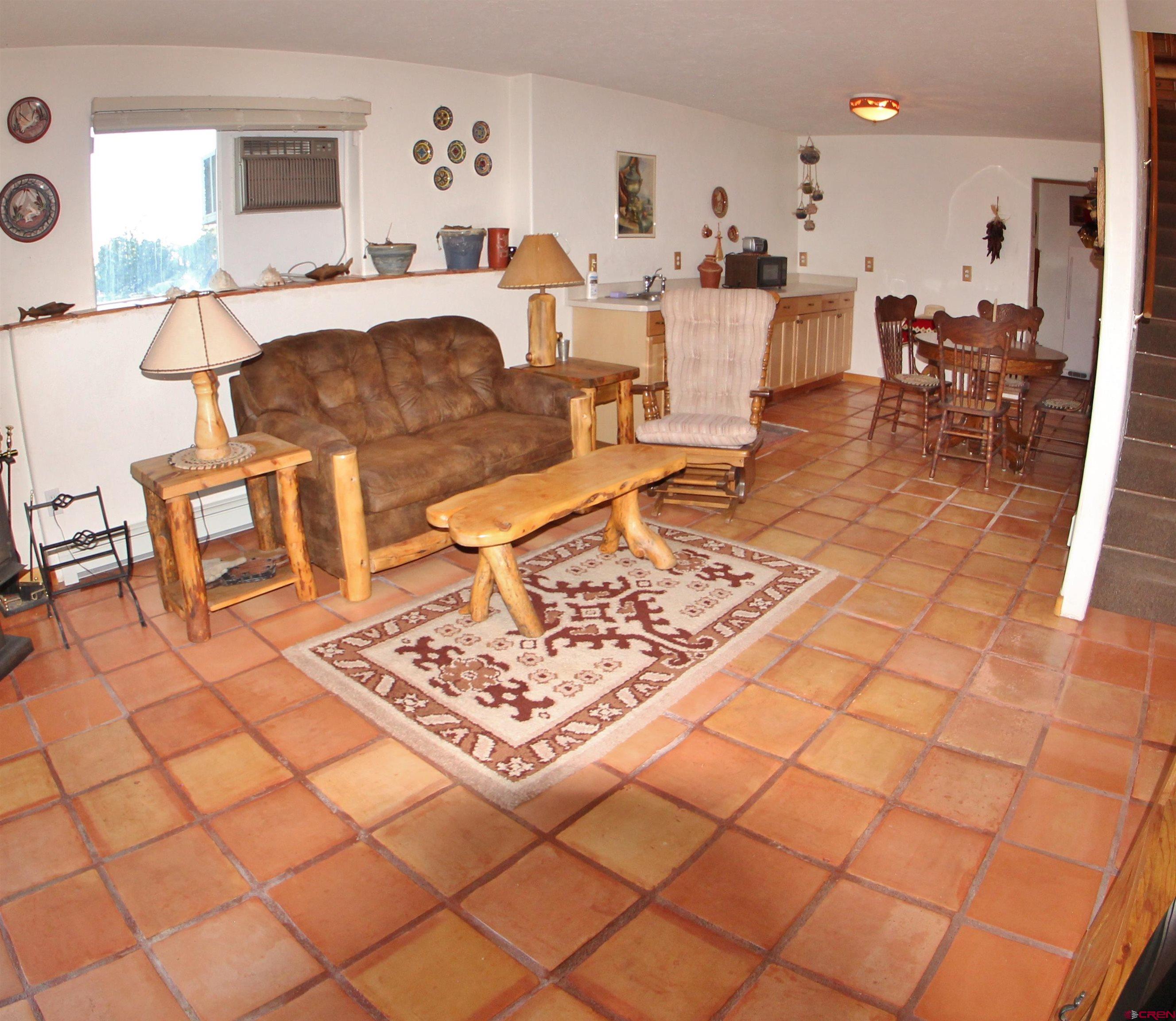 18094 Westridge Road Cedaredge, CO 81413 - Photo 19 of 35 a living room with a couch and a coffee table