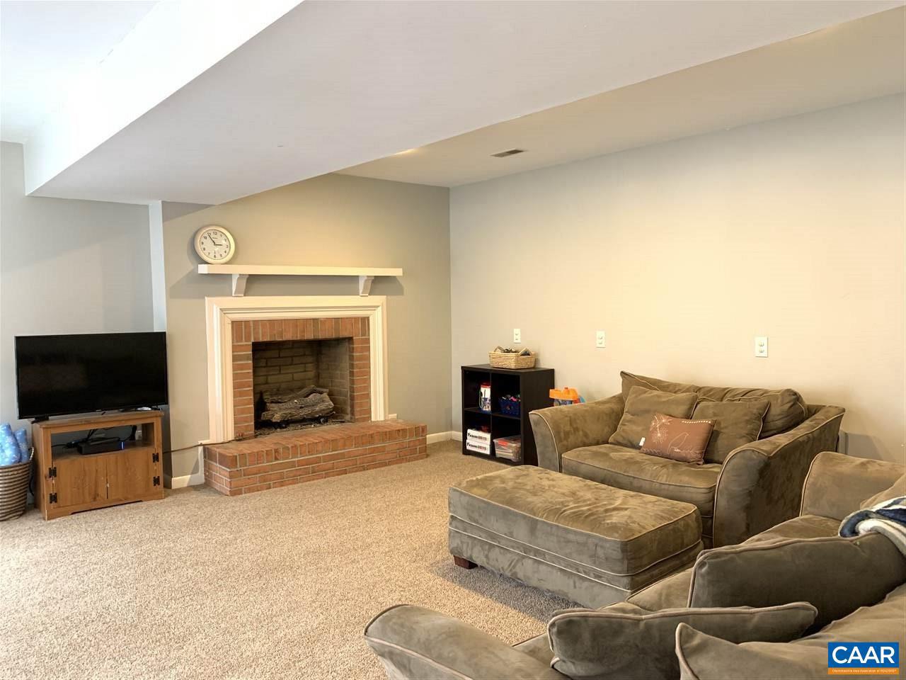 4354 Dickerson Road Charlottesville, VA 22911 - Photo 14 of 29 a living room with furniture and a flat screen tv