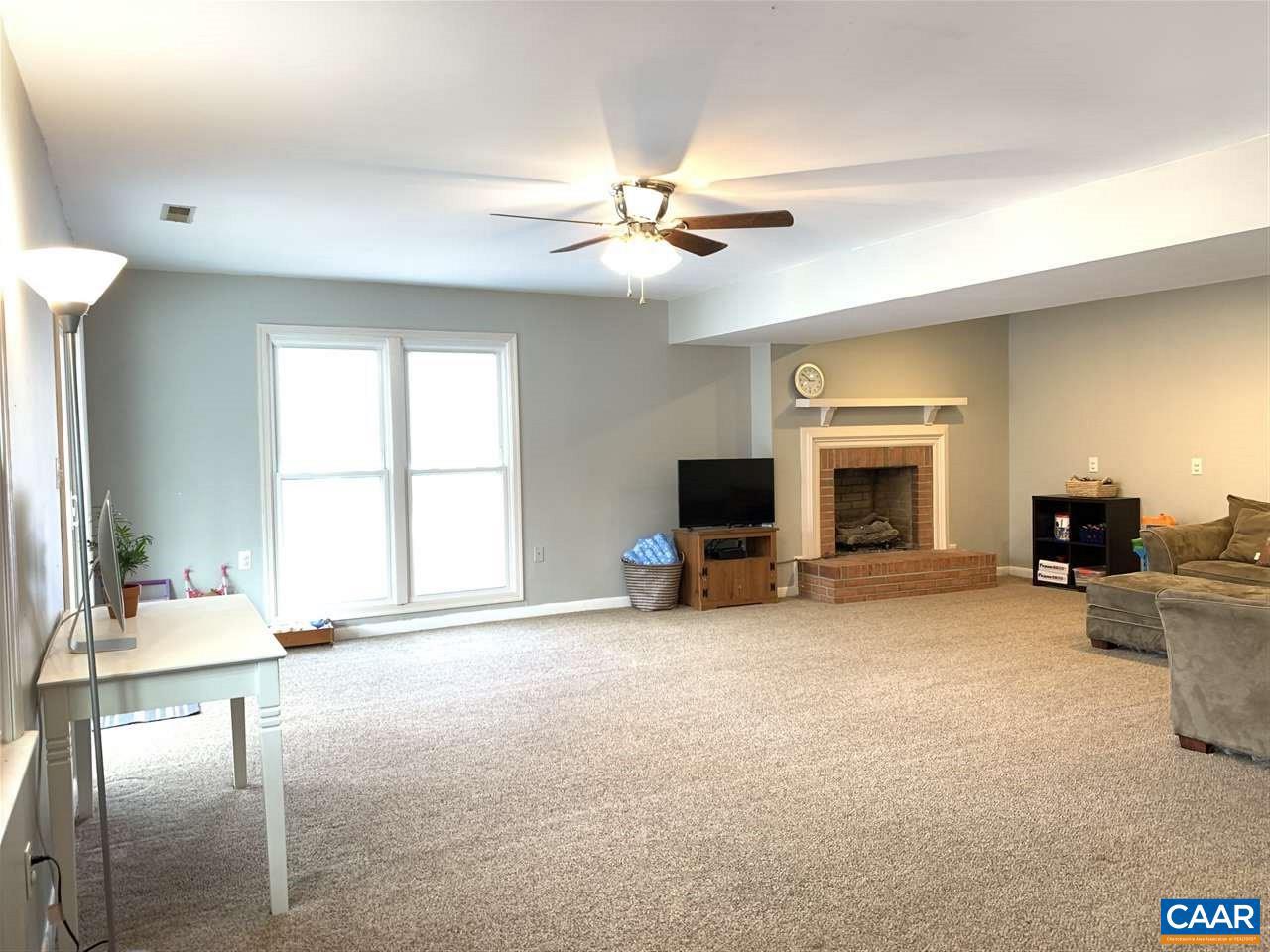 4354 Dickerson Road Charlottesville, VA 22911 - Photo 15 of 29 a living room with furniture and a fireplace