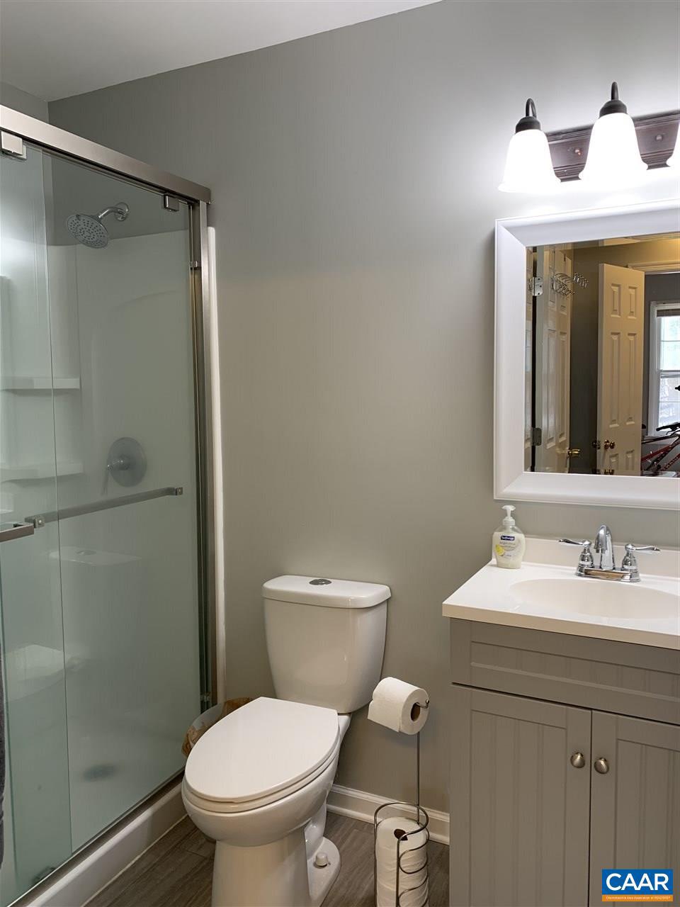 4354 Dickerson Road Charlottesville, VA 22911 - Photo 19 of 29 a bathroom with a toilet a sink and shower