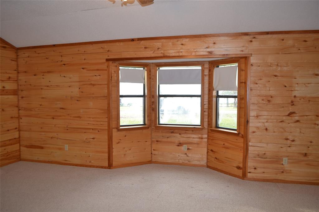 213 County Road 1997 Yantis, TX 75497 - Photo 12 of 38 a view of an empty room with a window
