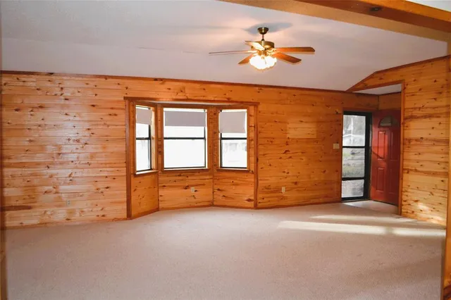 a kitchen with stainless steel appliances granite countertop wooden cabinets a stove a sink and dishwasher