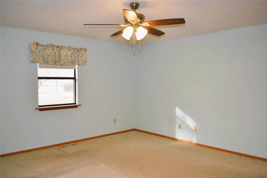 213 County Road 1997 Yantis, TX 75497 - Photo 19 of 38 a view of a room with a window and a ceiling fan