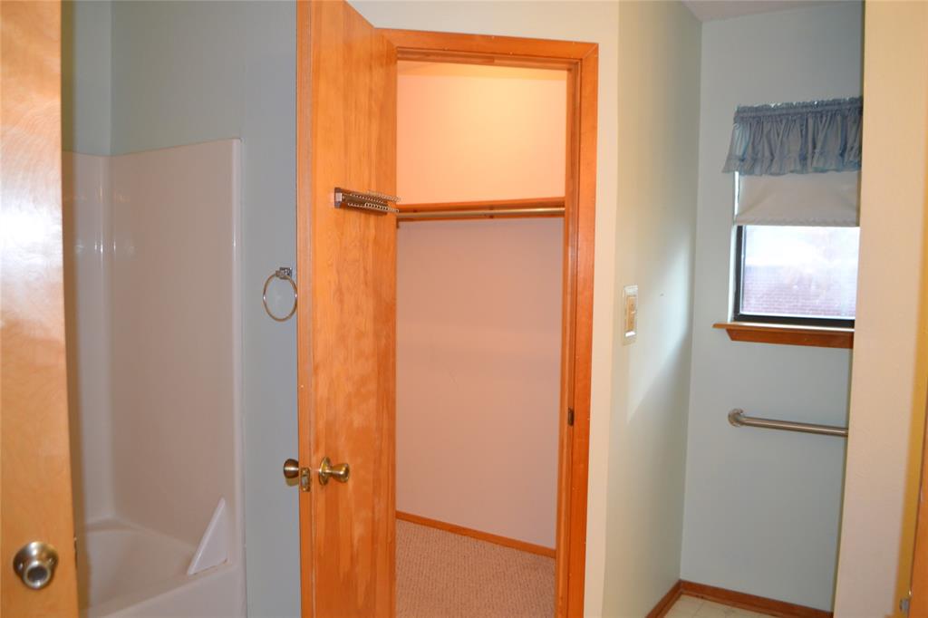 213 County Road 1997 Yantis, TX 75497 - Photo 23 of 38 a bathroom with a glass shower door
