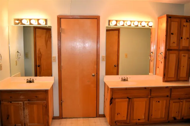 a bathroom with a glass shower door