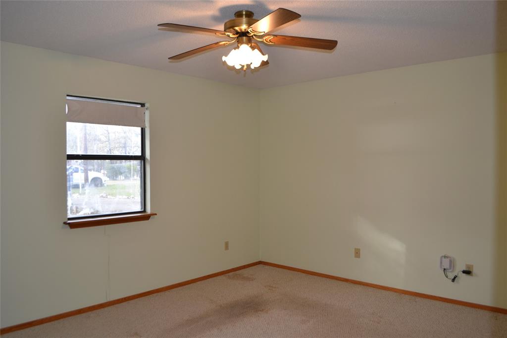 213 County Road 1997 Yantis, TX 75497 - Photo 28 of 39 an empty room with windows and fan