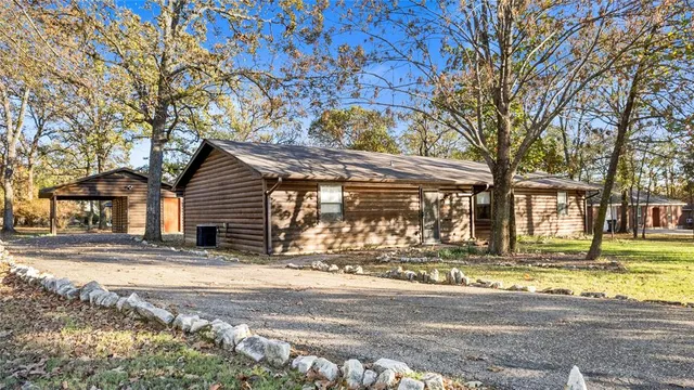 a view of a house with a yard patio and deck