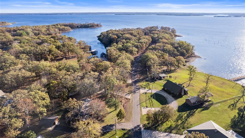 213 County Road 1997 Yantis, TX 75497 - Photo 10 of 39 a view of ocean with a building in the background