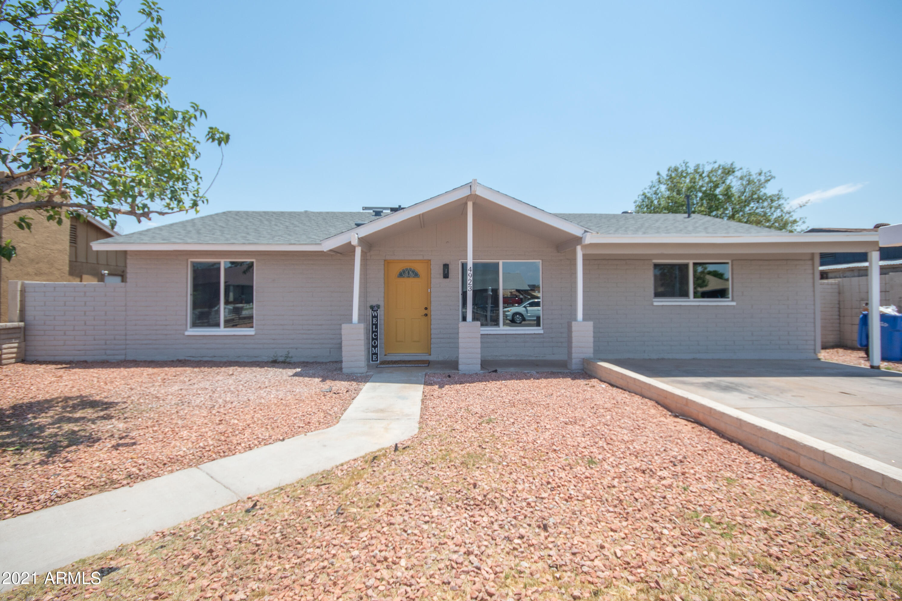 4923 West Granada Road Phoenix, AZ 85035 - Photo 1 of 27 a front view of a house with a yard
