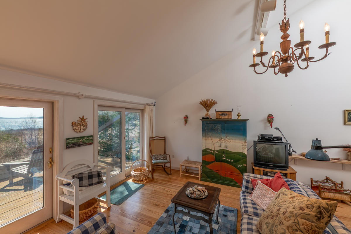 91 Meadow Point Road Lamoine, ME 04605 - Photo 32 of 42 Living room w/ 2 doors to deck