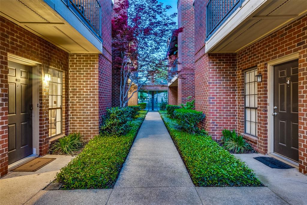 a view of a pathway both side of the house