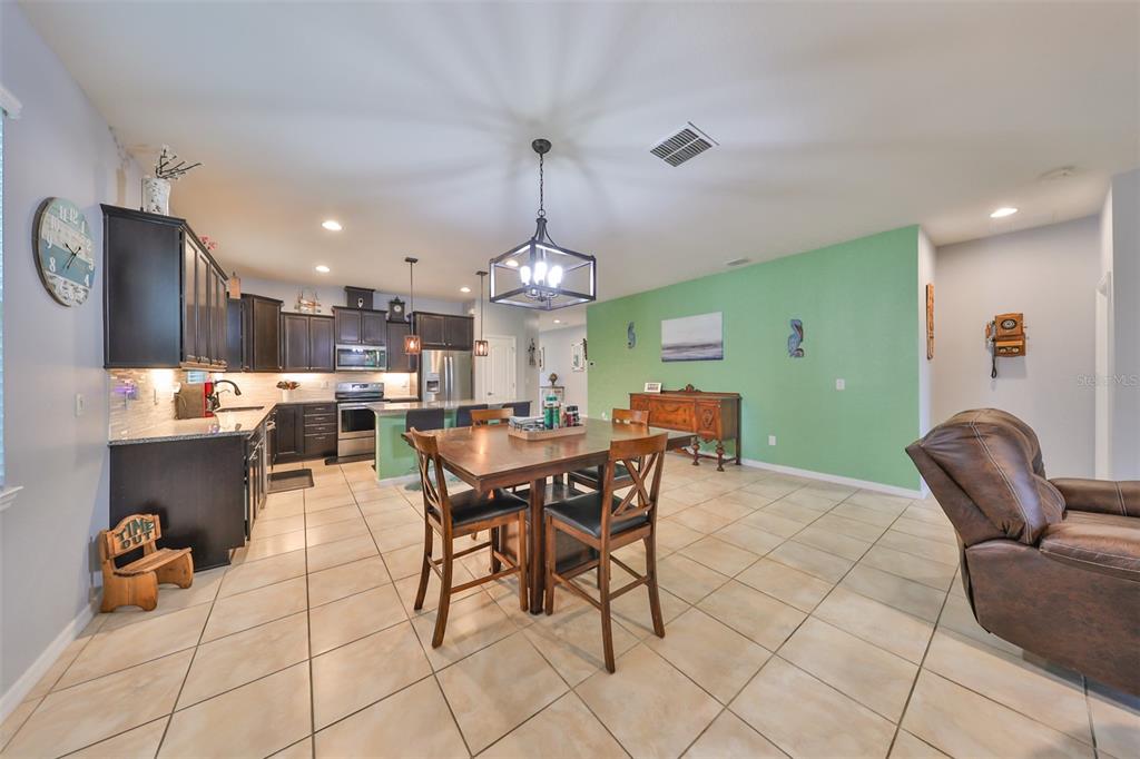 1606 Cabbage Key Drive Ruskin, FL 33570 - Photo 12 of 31 a view of a dining room with furniture
