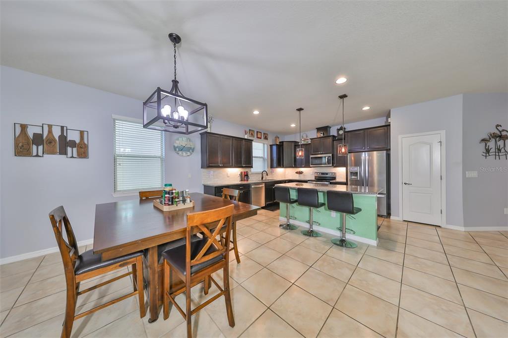1606 Cabbage Key Drive Ruskin, FL 33570 - Photo 13 of 31 a view of a dining room with furniture