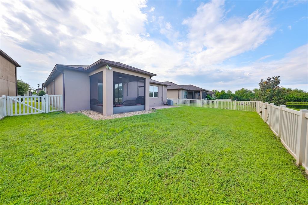 1606 Cabbage Key Drive Ruskin, FL 33570 - Photo 18 of 31 a view of a house with a yard and sitting area