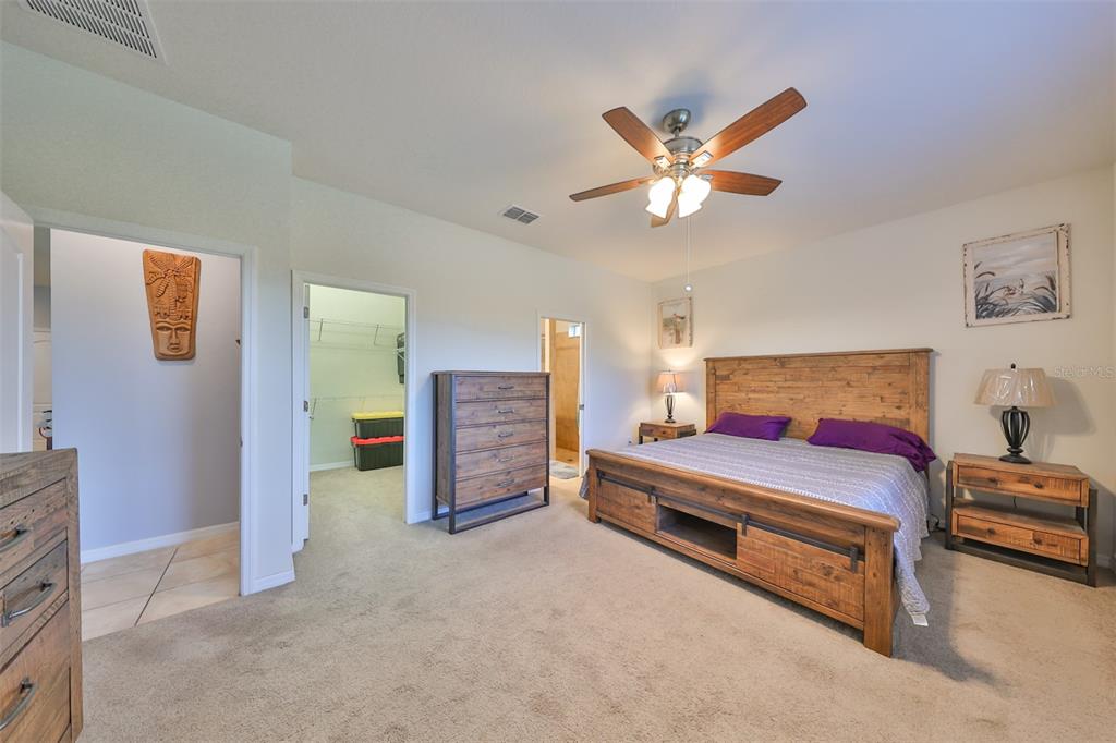 1606 Cabbage Key Drive Ruskin, FL 33570 - Photo 21 of 31 a bedroom with furniture and a ceiling fan