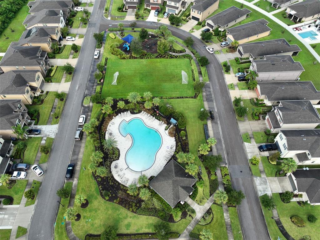 1606 Cabbage Key Drive Ruskin, FL 33570 - Photo 30 of 31 an aerial view of a house with a yard and green space