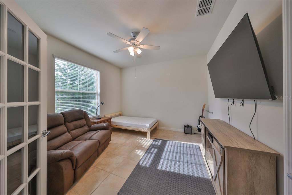 1606 Cabbage Key Drive Ruskin, FL 33570 - Photo 5 of 31 a bedroom with furniture and a window