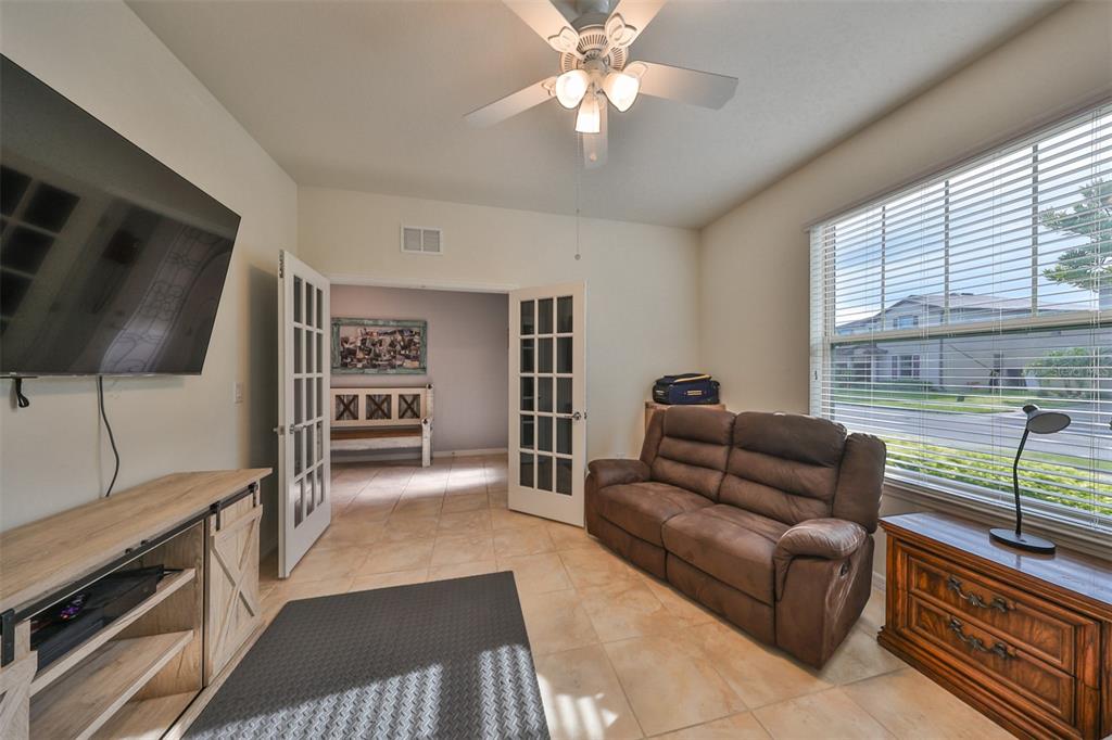 1606 Cabbage Key Drive Ruskin, FL 33570 - Photo 6 of 31 a living room with furniture and a flat screen tv
