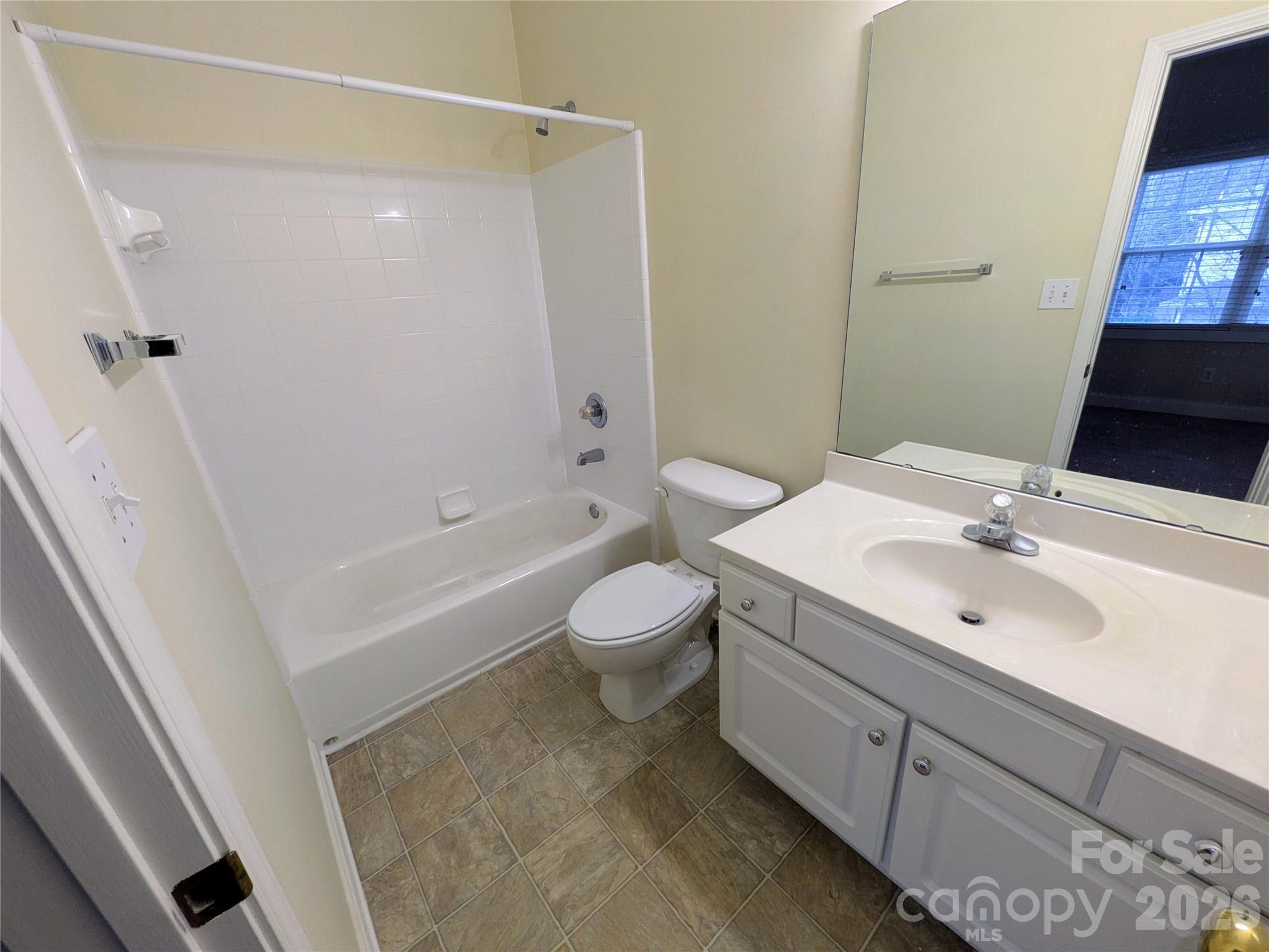 917 Shearer Street, Unit 20 Davidson, NC 28036 - Photo 11 of 16 a bathroom with a sink toilet tub and shower
