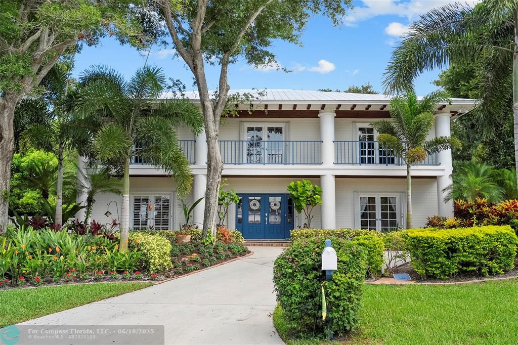 front view of a building with a garden