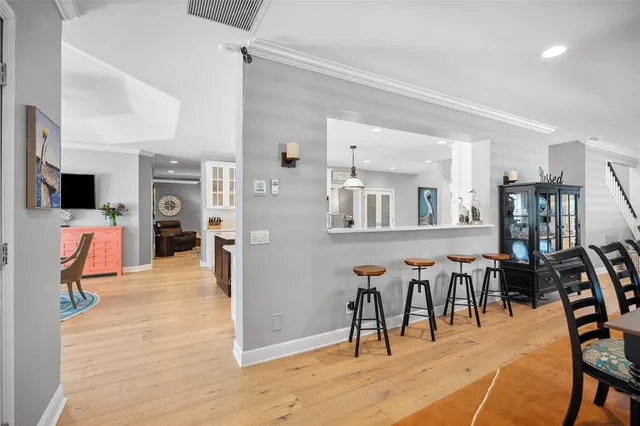 a living room with furniture a window and a flat screen tv