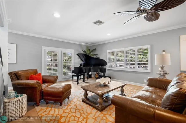 a bedroom with a bed and a flat tv screen on dresser