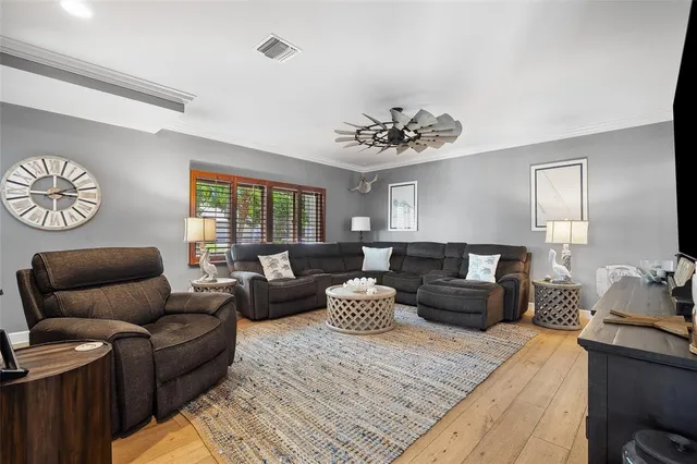 a bedroom with a bed and a flat tv screen on the dresser