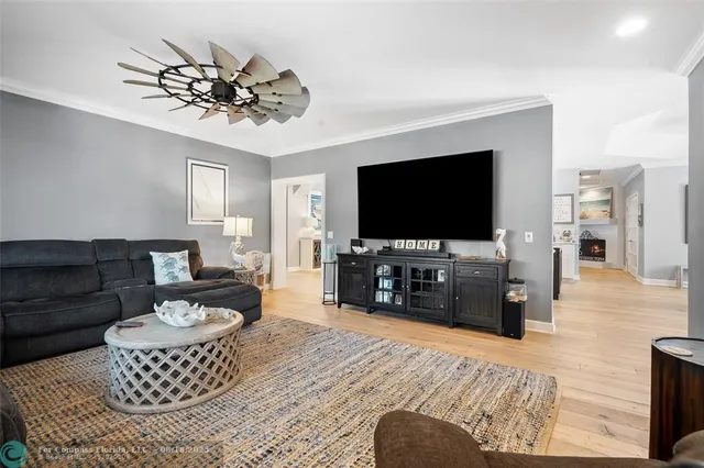 a living room with furniture a rug and a table