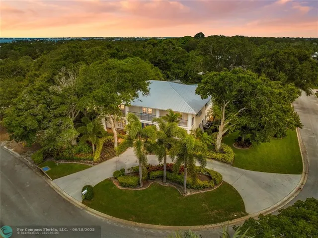 front view of a house with a potted plant