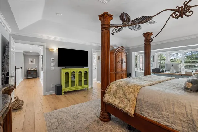 a bedroom with two beds and window