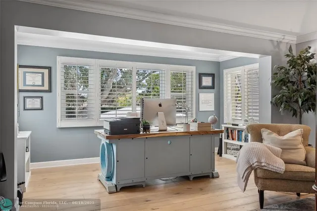 a bedroom with two beds and window
