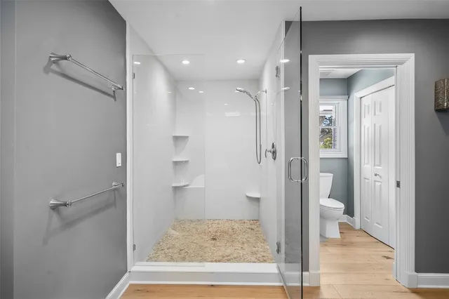 a bedroom with furniture and a window