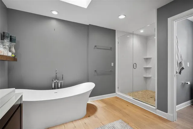 a bathroom with a sink toilet and a mirror