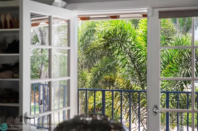 a view of a swimming pool with chairs in front of it