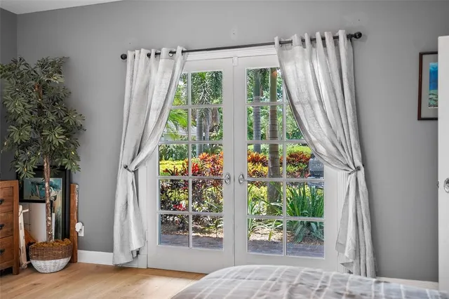 a view of a patio with table and chairs and potted plants