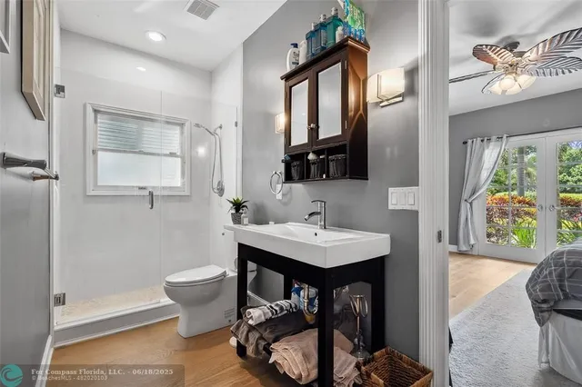 a view of a patio with table and chairs and potted plants
