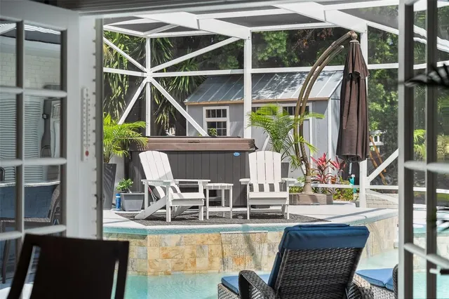 an aerial view of a house with garden space and street view