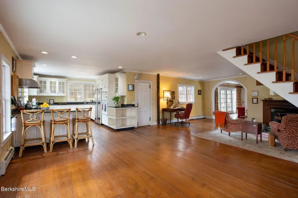 a view of entryway with a window and wooden floor