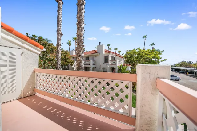 a view of a roof deck with wooden fence