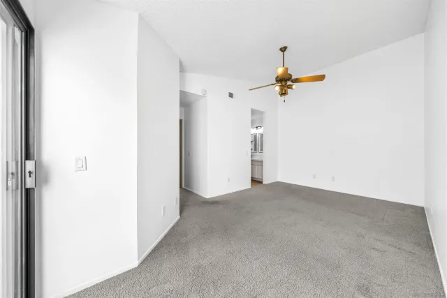 a view of a hallway with stairs