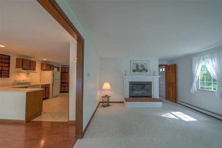 735 River Road Marstons Mills, MA 02648 - Photo 10 of 34 a view of a livingroom with a fireplace