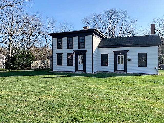 251 Tonset Road Orleans, MA 02653 - Photo 1 of 61 a backyard of a house with large trees and barbeque oven