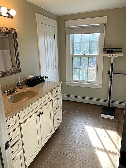 251 Tonset Road Orleans, MA 02653 - Photo 15 of 61 a bathroom with a sink a mirror and a bathtub