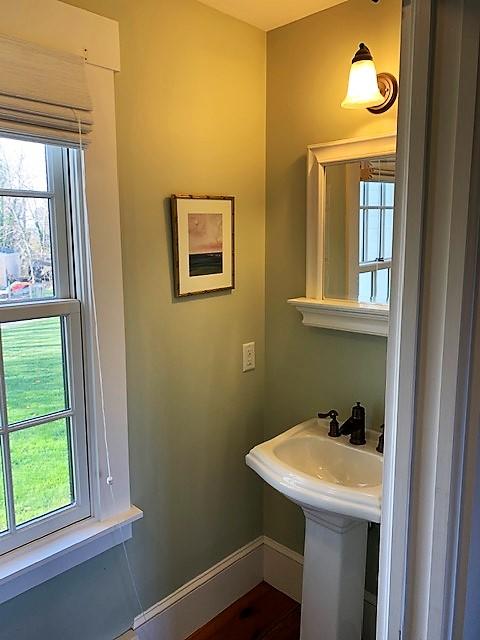 251 Tonset Road Orleans, MA 02653 - Photo 19 of 61 a bathroom with a sink a window and a mirror
