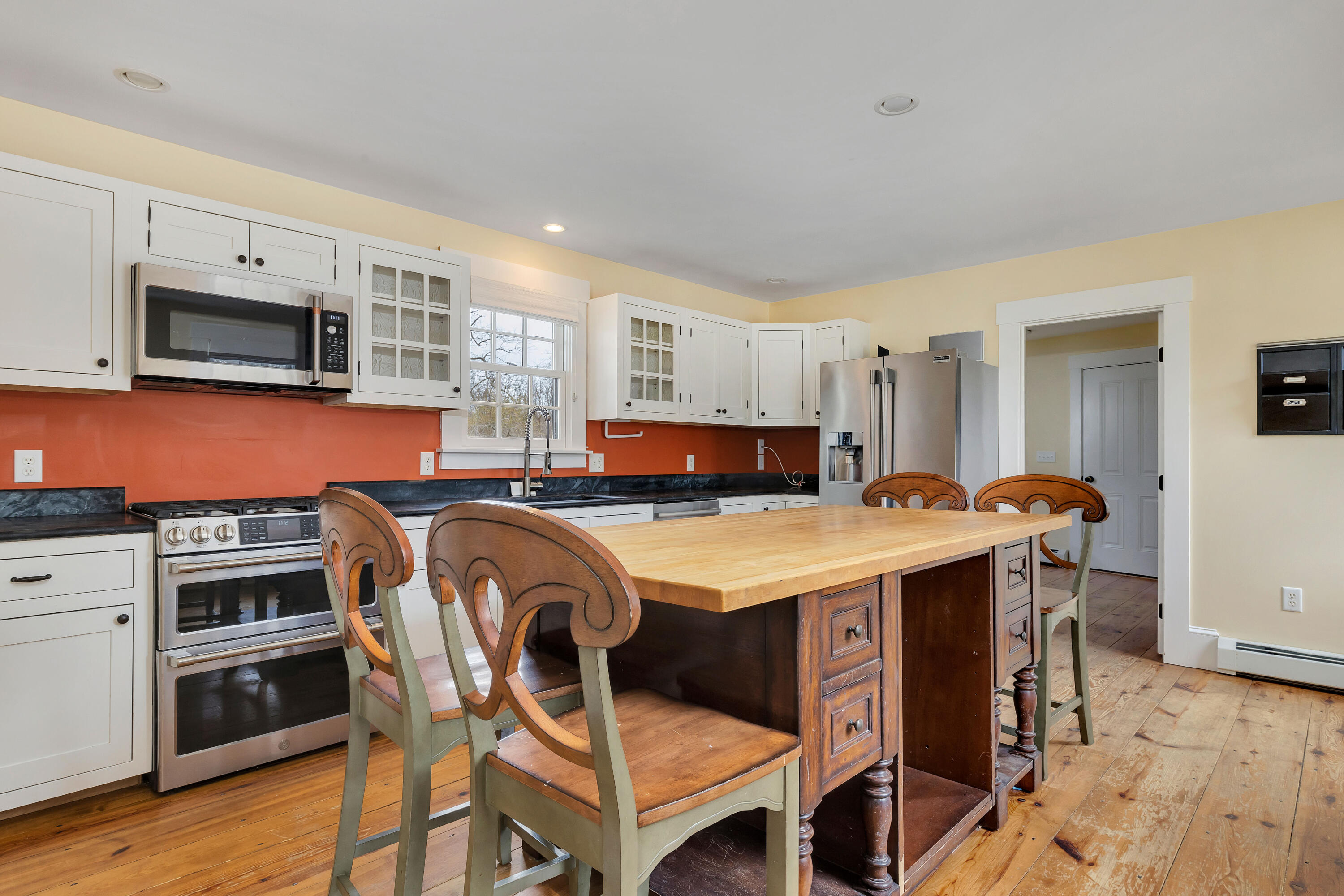 251 Tonset Road Orleans, MA 02653 - Photo 24 of 61 a kitchen with a stove a sink and a refrigerator