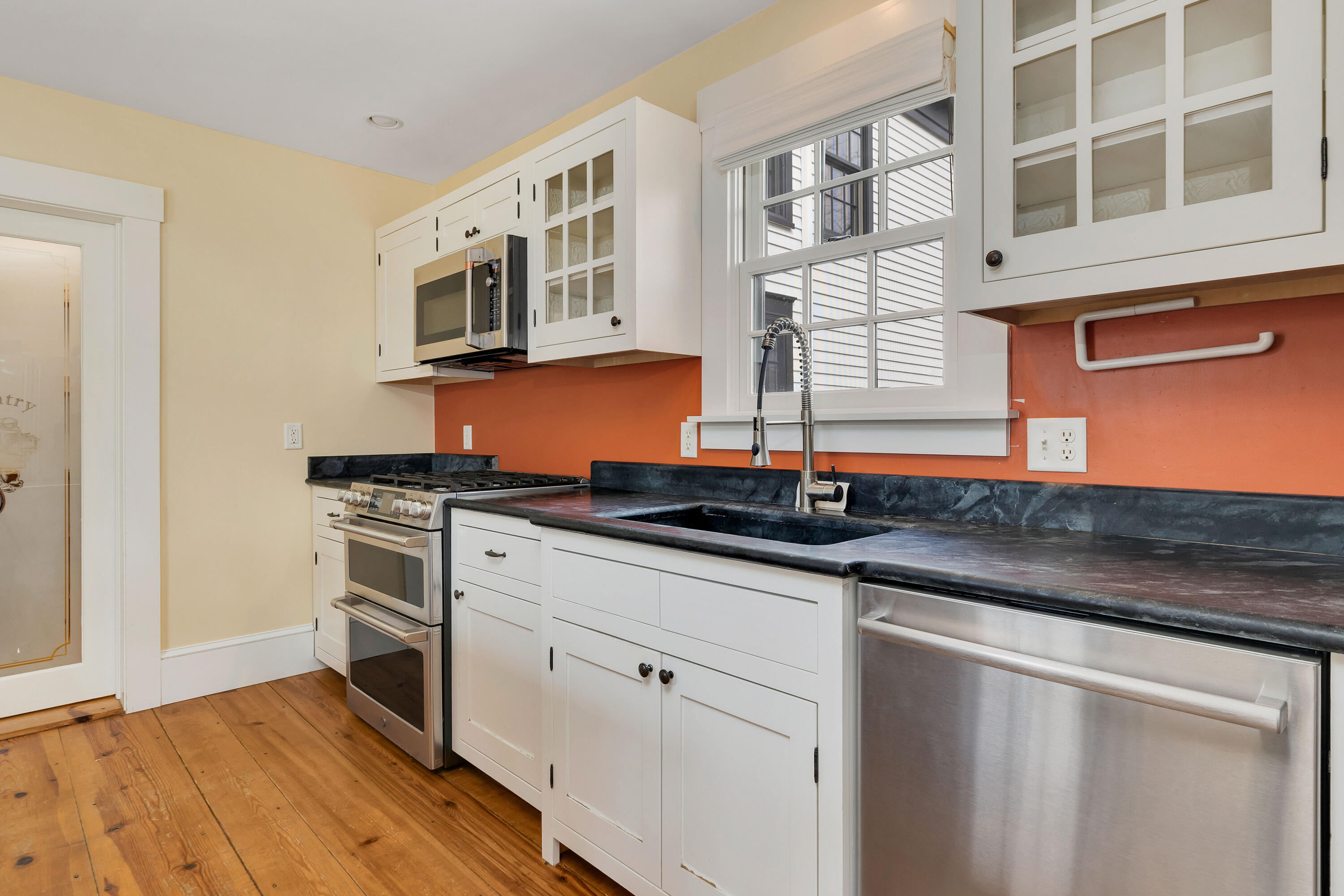 251 Tonset Road Orleans, MA 02653 - Photo 25 of 61 a kitchen with stainless steel appliances granite countertop a sink and a stove
