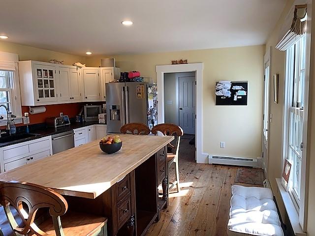 251 Tonset Road Orleans, MA 02653 - Photo 26 of 61 a kitchen with stainless steel appliances granite countertop a refrigerator and a stove top oven