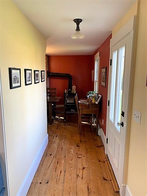 251 Tonset Road Orleans, MA 02653 - Photo 31 of 61 a view of a hallway with wooden floor and furniture